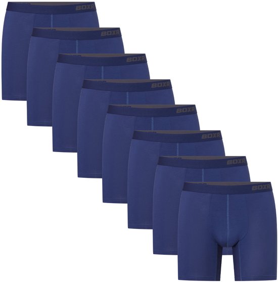 Een rij van zeven marineblauwe BOXR boxershorts met donkerblauwe taillebanden.