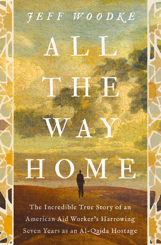 Boekcover met de titel "ALL THE WAY HOME" door JEFF WOODKE. Een man staat op een heuvel met een schilderachtige achtergrond.