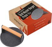 Gietijzeren hamburgerpers met houten handvat, naast de verpakking met de tekst 'THE ORIGINAL GRILL MASTER BURGER PRESS'.