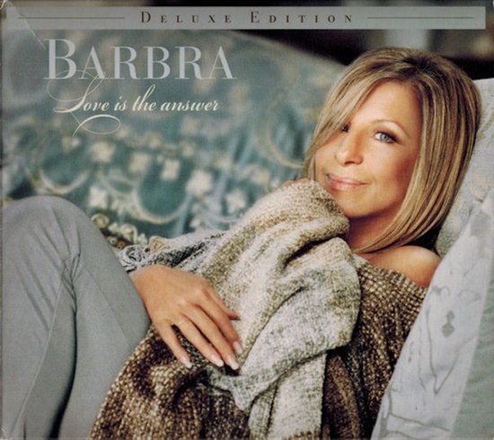 Barbra Streisand ligt op een bank met een deken om haar heen. Albumtitel 'Love is the answer'.