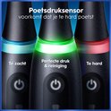 Close-up van de onderkant van drie zwarte Oral-B tandenborstels met druksensorindicatoren: te zacht, perfect, te hard.