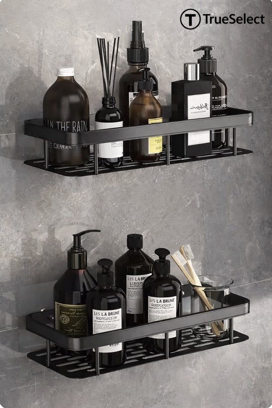 Étagère de douche noire avec un distributeur de mousse, deux bouteilles brunes, une bouteille noire et une bouteille avec des bâtonnets.