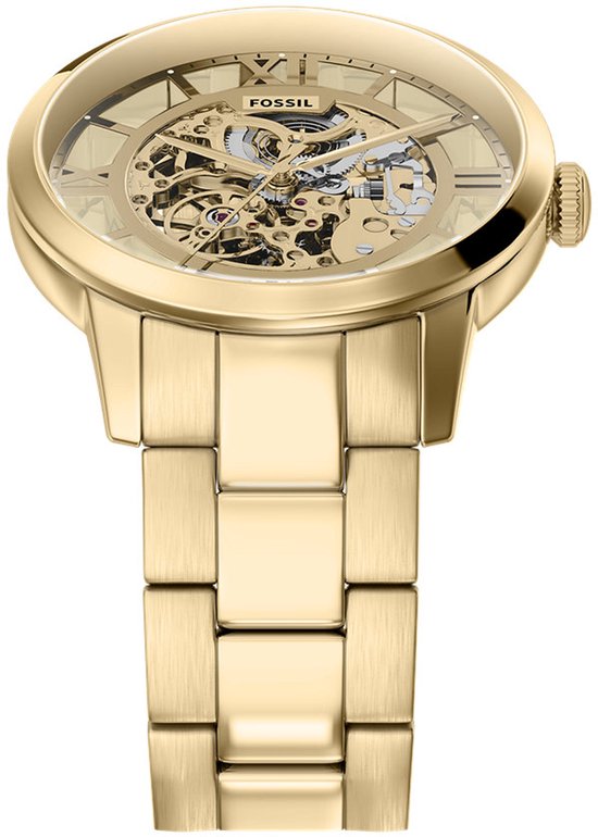 Goudkleurig Fossil skeleton horloge met een metalen band en zichtbare mechaniek.