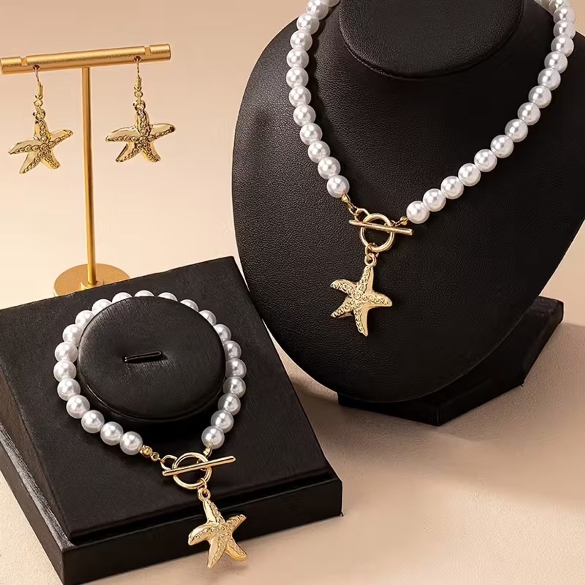My Sweet Romance® - Modieuze sieradenset met strandthema, bestaande uit een parelketting, een bijpassende armband en zeesteroorbellen