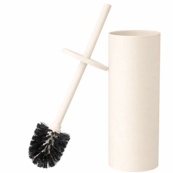 Brosse toilet crème avec poils noirs et un support rectangulaire assorti.