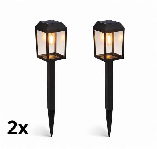 Twee zwarte staande tuinlampen met glazen behuizing en gloeilamp, met "2x" tekst.