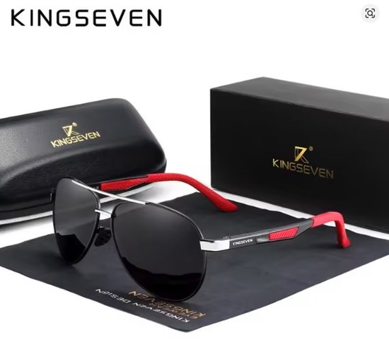 Piloten zonnebril met zwart glas, zilverkleurig metaal en rode accenten op de veren. Inclusief Kingseven brillenkoker en zwarte doos.