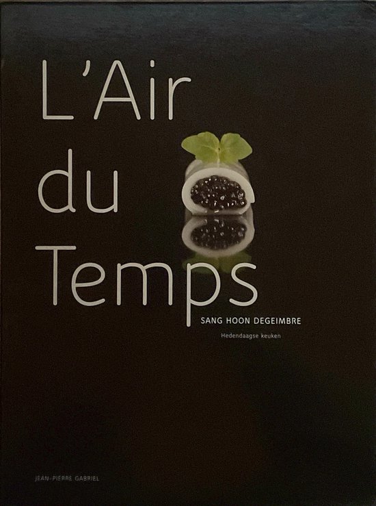L'Air du Temps: Hedendaagse keuken. Een delicaat gerechtje met zwarte parels en een blaadje munt.
