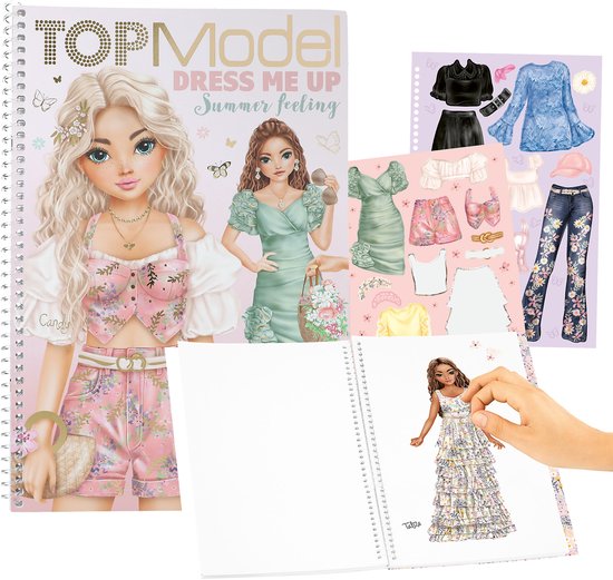 Livre d'autocollants TOPModel 'Summer Feeling' avec deux poupées et une main collant une robe. Vêtements et accessoires séparés visibles.