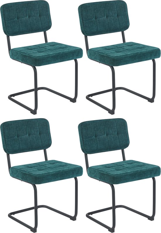 Set van vier groene eetkamerstoelen met gecapitonneerde zitting en rugleuning.