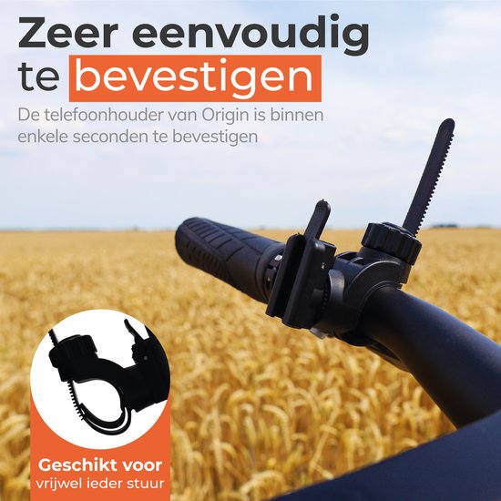 Zwarte Origin telefoonhouder bevestigd aan een fietsstuur, met een veld met tarwe op de achtergrond. "Zeer eenvoudig te bevestigen".