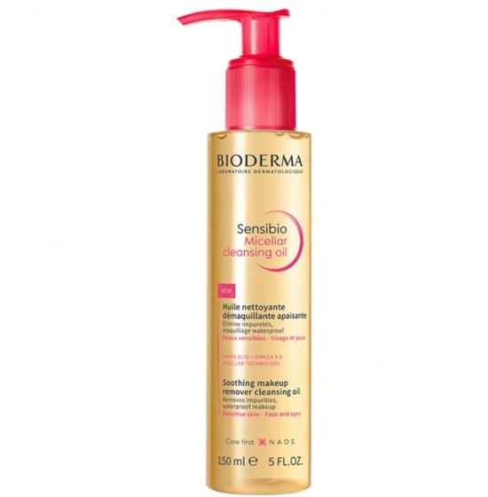 Huile démaquillante micellaire Bioderma Sensibio avec pompe. Liquide jaune dans une bouteille transparente avec un bouchon rose.