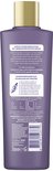 Achterkant van een paarse fles Andrélon Pro-Care Conditioner met gouden dop, met productinformatie.