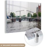 MuchoWow® Glasschilderij 60x40 cm - Schilderij acrylglas - Haarlem - Water - Nederland - Foto op glas - Schilderijen