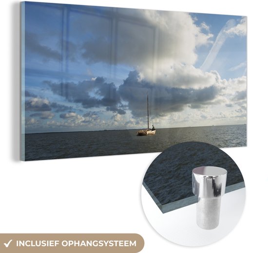 MuchoWow® Glasschilderij 120x60 cm - Schilderij glas - Een zeilboot op het water bij Ameland - Foto op acrylglas - Schilderijen