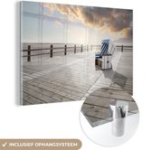 MuchoWow® Glasschilderij 120x80 cm - Schilderij acrylglas - Eenzame strandstoel in Nord Friesland - Foto op glas - Schilderijen