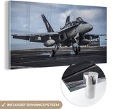 MuchoWow® Glasschilderij 80x40 cm - Schilderij acrylglas - Vliegtuig - Wielen - Lucht - Foto op glas - Schilderijen