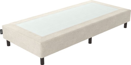 Boxspring beige de Mörgenn avec une surface brillante de couleur claire et quatre pieds courts foncés.