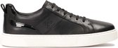 Black leather sneakers on a white sole