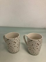 2 mooie witte mokken. Met goude stippen
