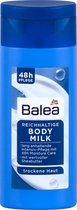 DM Balea Reisflesje bodymilk voor de droge huid -  met sheaboter, vitamine E en lipiden - reisverpakking (50 ml)