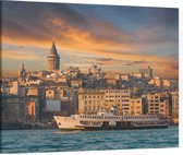 Zicht op een veerboot en de Galatatoren in Istanbul - Foto op Canvas - 100 x 75 cm