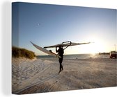 Un véliplanchiste sort de la mer toile 140x90 cm - Tirage photo sur toile (Décoration murale salon / chambre)