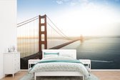 Behang - Fotobehang Ochtendmist bij de Golden Gate Bridge in Californië - Breedte 450 cm x hoogte 300 cm