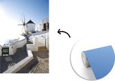 Behang - Fotobehang Windmolen op Santorini in Griekenland - Breedte 175 cm x hoogte 260 cm