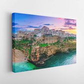 Canvas schilderij - Polignano a Mare, Puglia, Italy: Sunset at Cala Paura gulf with Bastione di Santo Stefano and Lama Monachile beach in background, Apulia, Italy, province of Bari -     1099588256 - 80*60 Horizontal