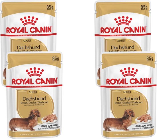 Vier zakjes Royal Canin Adult Dachshund van 85g. Elk zakje toont een teckel en brokken. Voor gewricht- en botondersteuning.