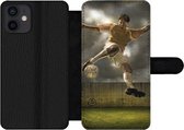 Bookcase Geschikt voor iPhone 12 telefoonhoesje - Een illustratie van een voetballer die tegen de bal schopt - Jongens - Jongetje - Kids - Met vakjes - Wallet case met magneetsluiting