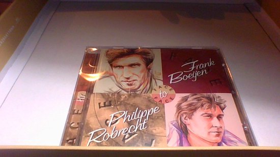 CD-hoes met portretten van Frank Boeijen en Philippe Robrecht, 'Face to Face' in sierlijk handschrift.