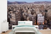 Behang - Fotobehang Zonsopkomst boven binnenstad Sanaa in Jemen - Breedte 450 cm x hoogte 300 cm