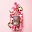 Fles 4711 Eau de Cologne Floral Collection Rose, omringd door roze rozen.