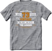 73 Jaar Legend T-Shirt | Goud - Wit | Grappig Verjaardag en Feest Cadeau Shirt | Dames - Heren - Unisex | Tshirt Kleding Kado | - Donker Grijs - Gemaleerd - S