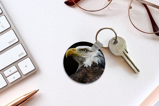 Porte-clés - Profil d'aigle sur fond noir - Plastique - Rond