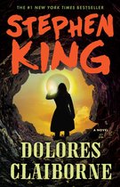 Boekomslag 'Dolores Claiborne' van Stephen King. Silhouet van vrouw kijkt naar licht in grot. #1 New York Times Bestseller.