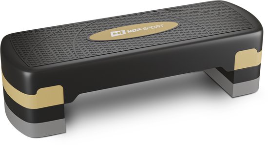 Zwarte aerobic stepper met goudkleurige en grijze accenten en een antislip oppervlak. Merk: Hop-Sport.