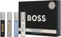 Vier BOSS Bottled mini-parfumflesjes: zwart, lichtgrijs, lichtblauw en crème, met een zwarte geschenkdoos.