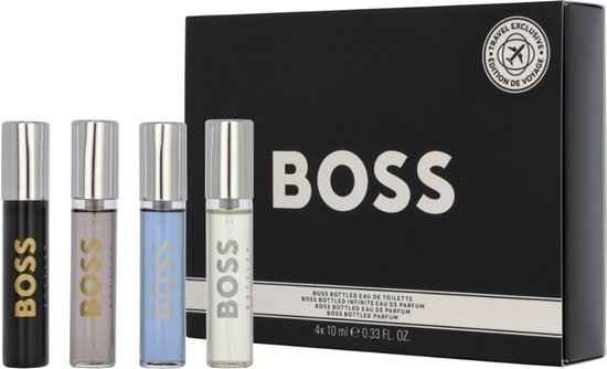 Vier BOSS Bottled mini-parfumflesjes: zwart, lichtgrijs, lichtblauw en crème, met een zwarte geschenkdoos.