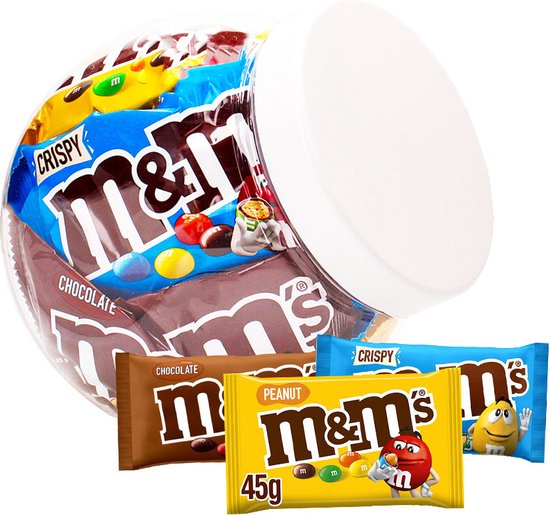 Doorzichtige pot met zakjes M&M's Crispy, Chocolate en Peanut. Voor de pot liggen zakjes Crispy, Peanut en Chocolate.