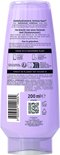 Arrière d'une bouteille d'après-shampooing L'Oréal Elvive Hydra Hyaluronic avec ingrédients et informations de recyclage.