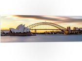 PVC Schuimplaat- Zonsondergang achter de Brug in Sydney, Australië - 120x40 cm Foto op PVC Schuimplaat