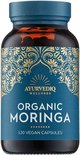 Een bruine fles Ayurvediq biologische moringa capsules met een blauw en goudkleurig etiket.