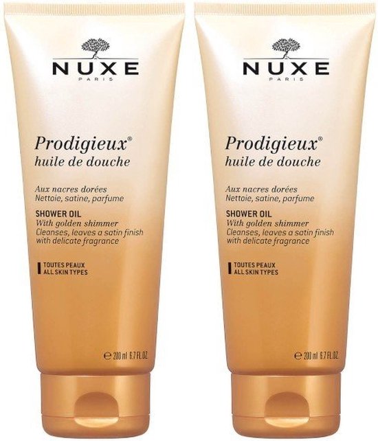 Twee gouden tubes Nuxe Prodigieux doucheolie, elk 200 ml.