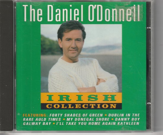 Daniel O'Donnell draagt een gebreide witte trui, met tekst 'The Daniel O'Donnell Irish Collection' en liedjes.