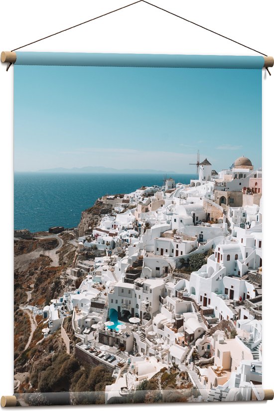 Textielposter - Uitzicht op Witte Gebouwen aan de Kust op Santorini - 60x80 cm Foto op Textiel