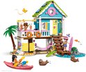 LEGO Friends strandhuis speelset. Blauw huis met roze accenten en groen dak. Met kajak, zeehonden en een palmboom.