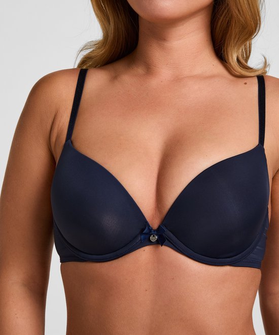 Close-up van een marineblauwe Plunge beugel bh met voorgevormde cups en een strikje middenvoor.